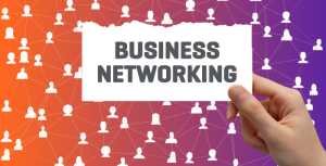 Person holding paper that says Business Networking