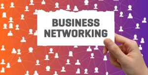 Person holding paper that says Business Networking