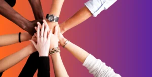 professional hands reaching on top of one another to represent a professional power circle and referral network